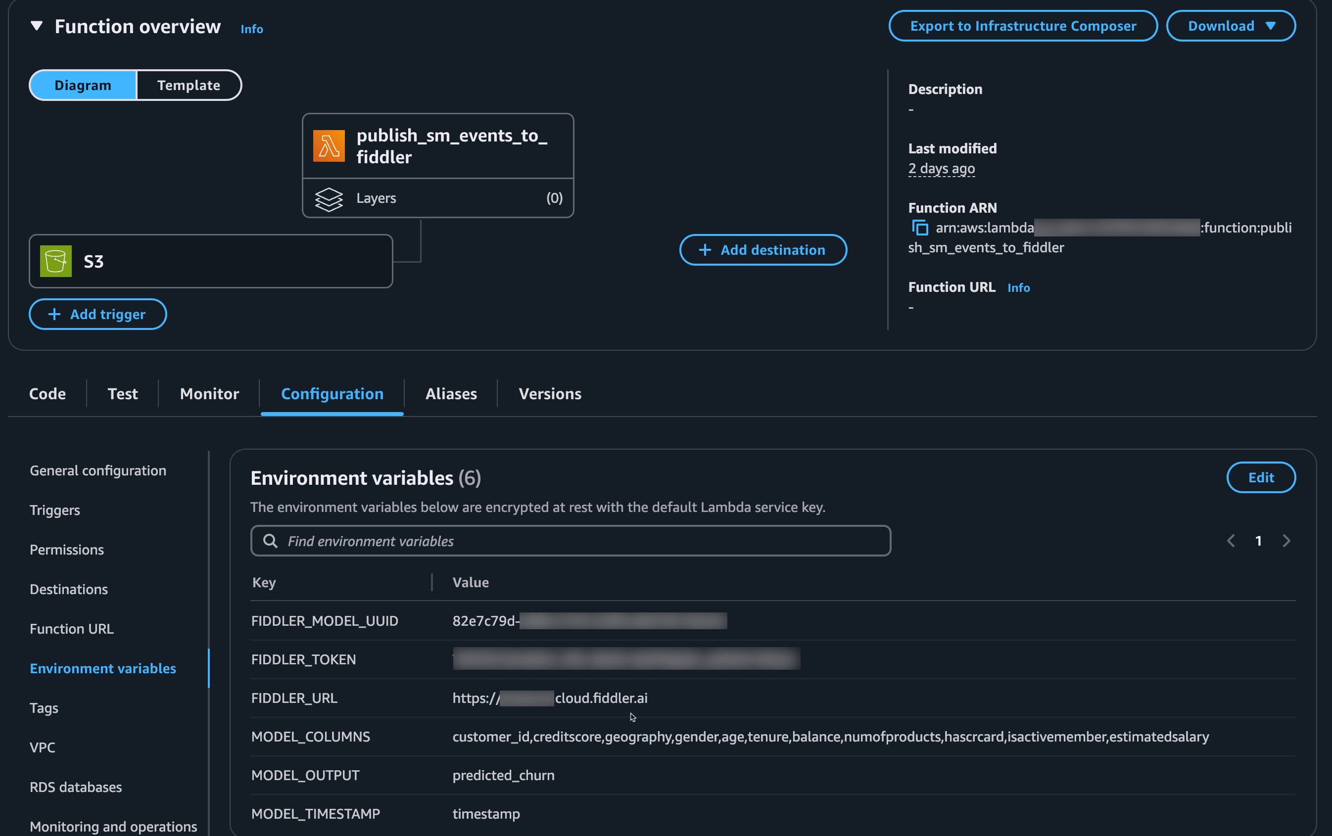AWS Lambda function console on the environment variables tab showing the example variables used in this guide.